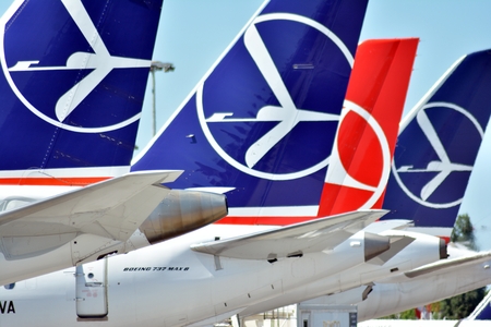 Warsaw, Poland. 6 June 2018. Warsaw Chopin Airport. Airplane at the airport after landing. The plane at the airport in Warsaw. Airplanes are parked at the airport, close to refill trucks.のeditorial素材