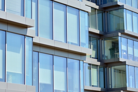 Urban abstract background, detail of modern glass facade, office business building