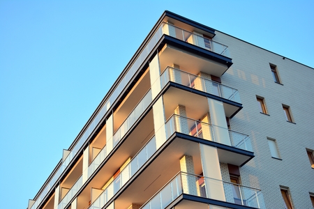Modern apartment buildings on a sunny day with a blue sky. Facade of a modern apartment building