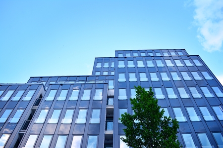 Urban abstract background, detail of modern glass facade, office business building