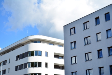 Modern apartment buildings on a sunny day with a blue sky. Facade of a modern apartment building