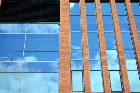 Urban abstract background, detail of modern glass facade, office business building