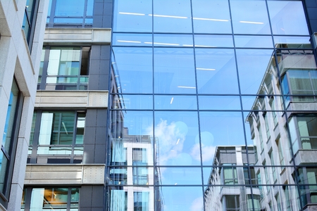 Blue clean glass wall of modern skyscraperの写真素材