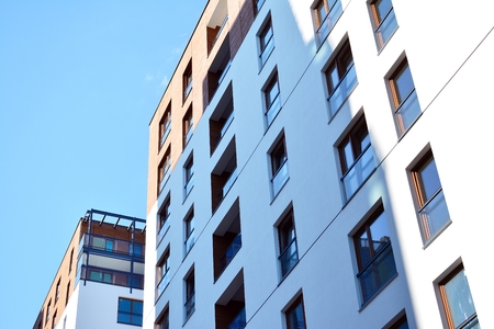 Brand new apartment building on sunny day