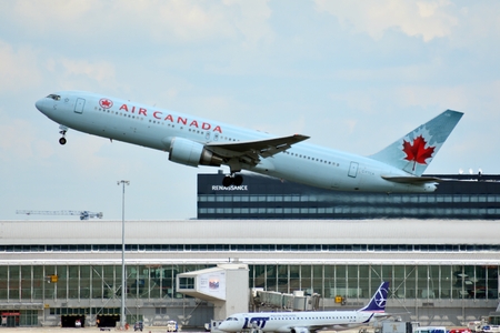 Warsaw, Poland. 26 July 2018. Airplane C-FTCA Air Canada Boeing 767-375 (ER) taking off from the Warsaw Chopin Airport.のeditorial素材