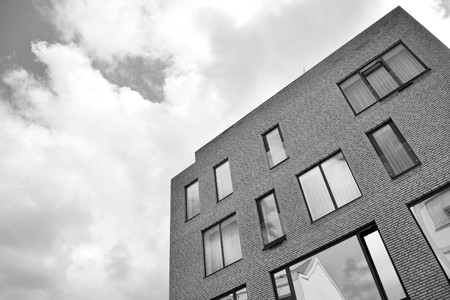 Modern apartment buildings. Facade of a modern apartment building. Black and white.