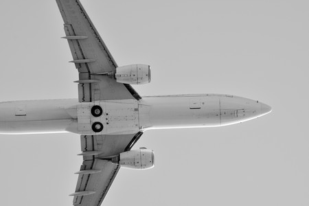 Plane on sky. Black and white.