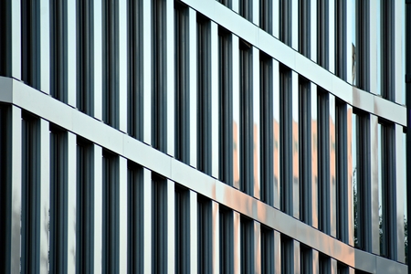 Urban abstract background, detail of modern glass facade, office business building.の写真素材