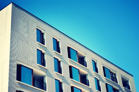 Modern apartment building exterior. Retro colors stylization