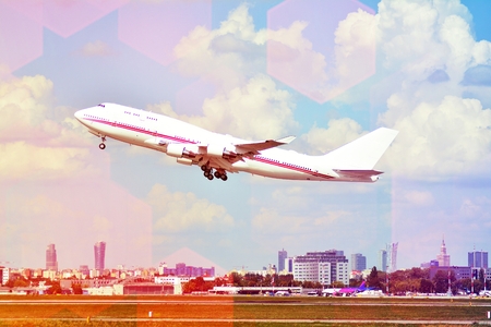 Airplane on the blue sky. A passenger plane is flying from the runway in the sun.