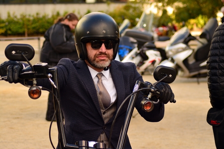 Warsaw, Poland. 29 September 2018. The Distinguished Gentleman's Ride on the European square. Motorcyclist on motorbike with in helmetのeditorial素材