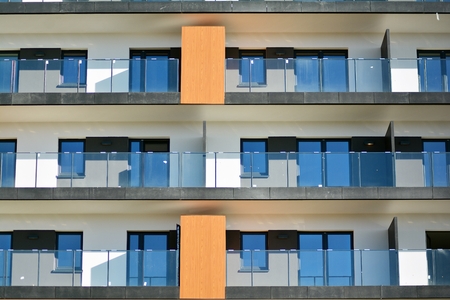 Modern apartment buildings on a sunny day with a blue sky. Facade of a modern apartment building.