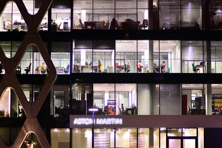 Warsaw, Poland. 20 November 2018. Office building Prosta Tower at night. Late night at work. Glass...