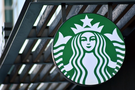 Warsaw, Poland. 1 December 2018. Sign Starbucks Coffee. Company signboard Starbucks Coffee.