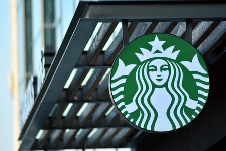 Warsaw, Poland. 1 December 2018. Sign Starbucks Coffee. Company signboard Starbucks Coffee.のeditorial素材