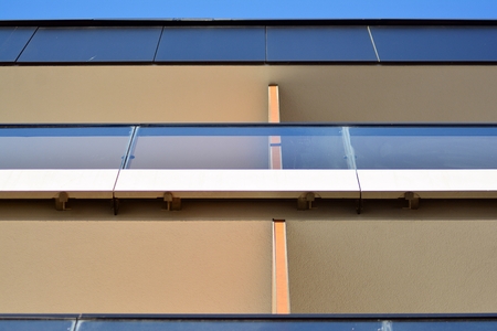 Modern apartment buildings on a sunny day with a blue sky. Facade of a modern apartment building