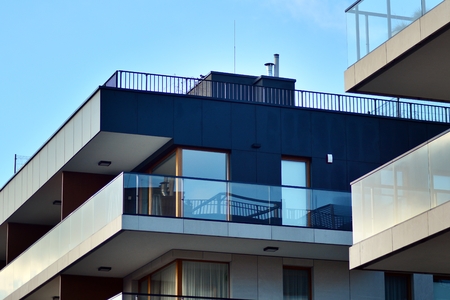 Modern apartment buildings on a sunny day with a blue sky. Facade of a modern apartment buildingの写真素材