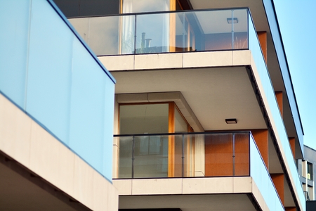 Modern apartment buildings on a sunny day with a blue sky. Facade of a modern apartment building