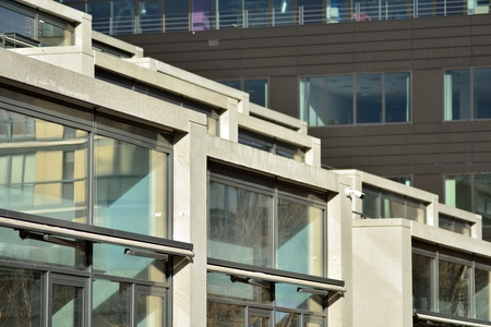 Abstract fragment of modern architecture, walls made of glass and concrete.