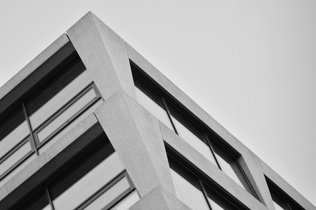 Abstract fragment of modern architecture, walls made of glass and concrete. Black and white.の写真素材