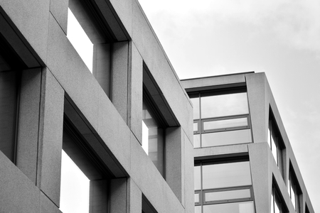 Abstract fragment of modern architecture, walls made of glass and concrete. Black and white.