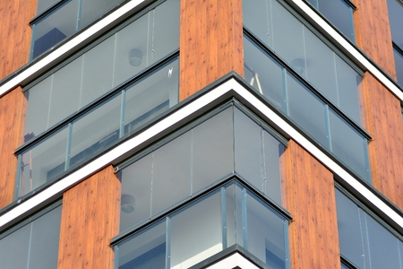 Modern apartment buildings on a sunny day with a blue sky. Facade of a modern apartment building
