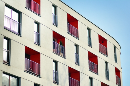 Modern apartment buildings on a sunny day with a blue sky. Facade of a modern apartment building