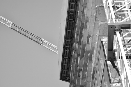 Crane attached to building. Black and white.の写真素材