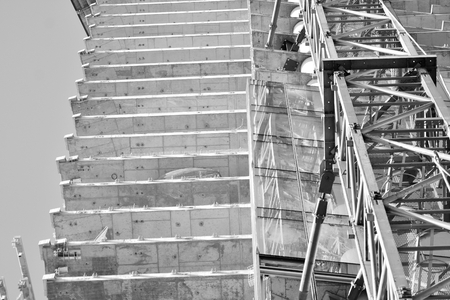 Crane attached to building. Black and white.の写真素材