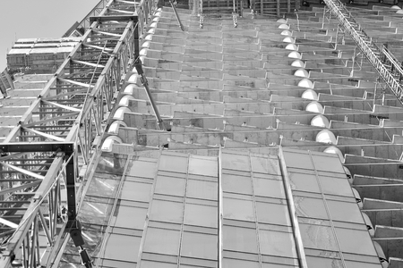 Crane attached to building. Black and white.の写真素材