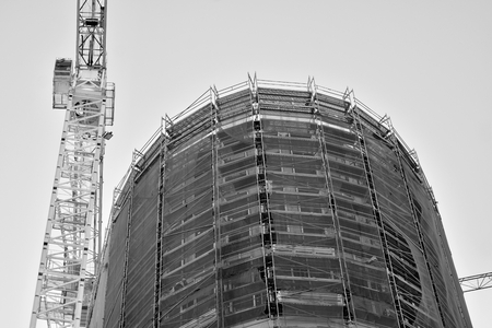 Crane attached to building. Black and white.の写真素材
