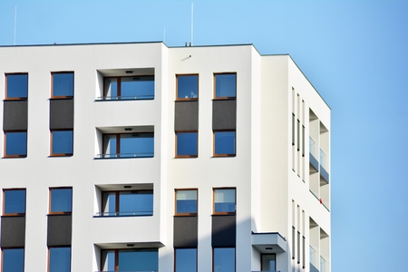 Modern apartment buildings on a sunny day with a blue sky. Facade of a modern apartment building