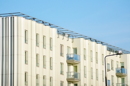Modern apartment buildings on a sunny day with a blue sky. Facade of a modern apartment buildingの写真素材