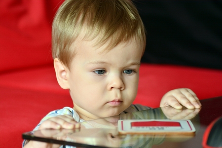 Cute boy with blond hair and blue eyesの写真素材