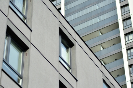 Multistory new modern apartment building. Stylish living block of flats.