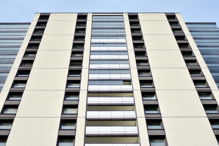 Multistory new modern apartment building. Stylish living block of flats.