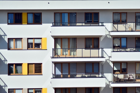 European modern residential architecture. Fragment of a modern apartment building in front. Very modern apartment house.の写真素材