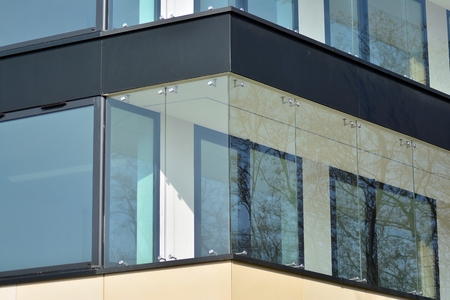European modern residential architecture. Fragment of a modern apartment building in front. Very...