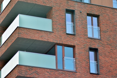European modern residential architecture. Fragment of a modern apartment building in front. Very...