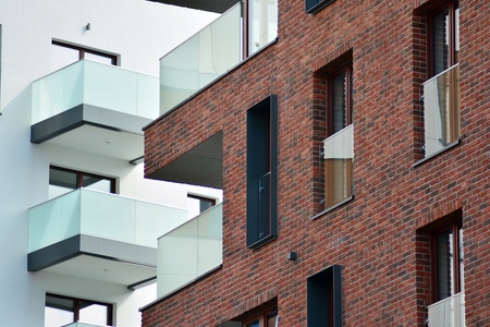 European modern residential architecture. Fragment of a modern apartment building in front. Very modern apartment house.の写真素材