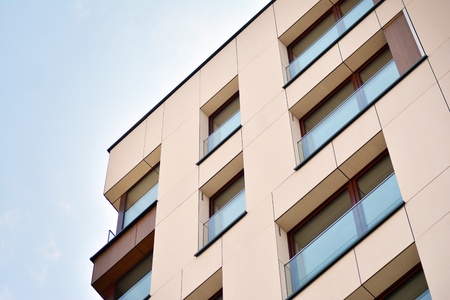 European modern residential architecture. Fragment of a modern apartment building in front. Very...