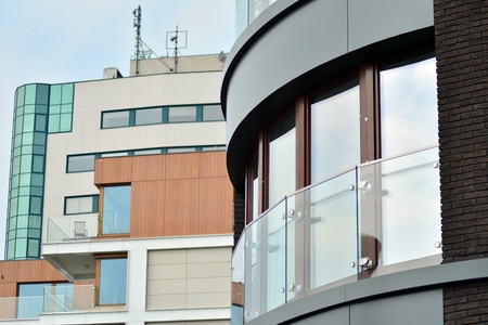 European modern residential architecture. Fragment of a modern apartment building in front. Very...