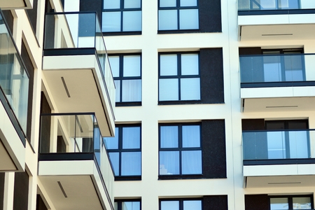Modern and new apartment building. Multistoried modern, new and stylish living block of flats.
