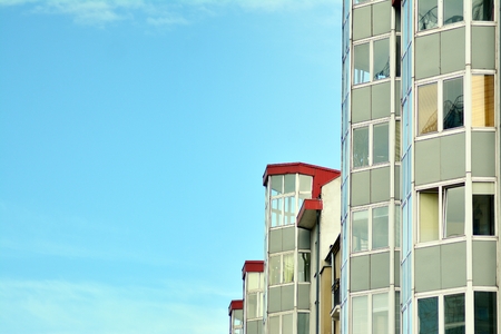 Modern apartment buildings on a sunny day with a blue sky. Facade of a modern apartment building