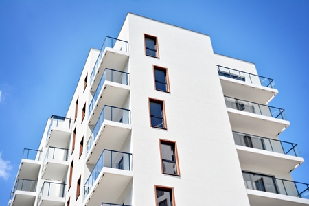 Modern apartment buildings on a sunny day with a blue sky. Facade of a modern apartment buildingの写真素材