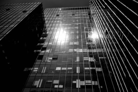 Black glass silhouette of skyscraper at night.The gloomy city of skyscrapers. Black and white.