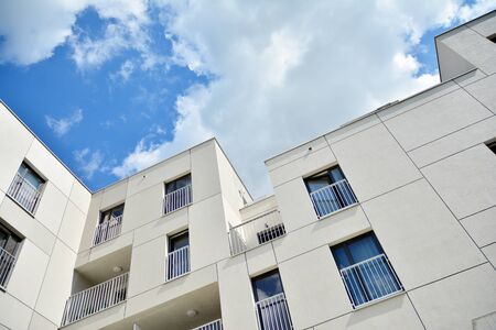 Multistory new modern apartment building. Stylish living block of flats.