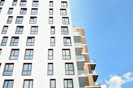 Multistory new modern apartment building. Stylish living block of flats.