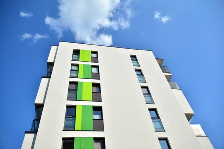 Contemporary residential building exterior in the daylight. Modern apartment buildings on a sunny...