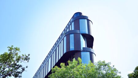 Modern office building with reflection in windows of building. New office building in the city...